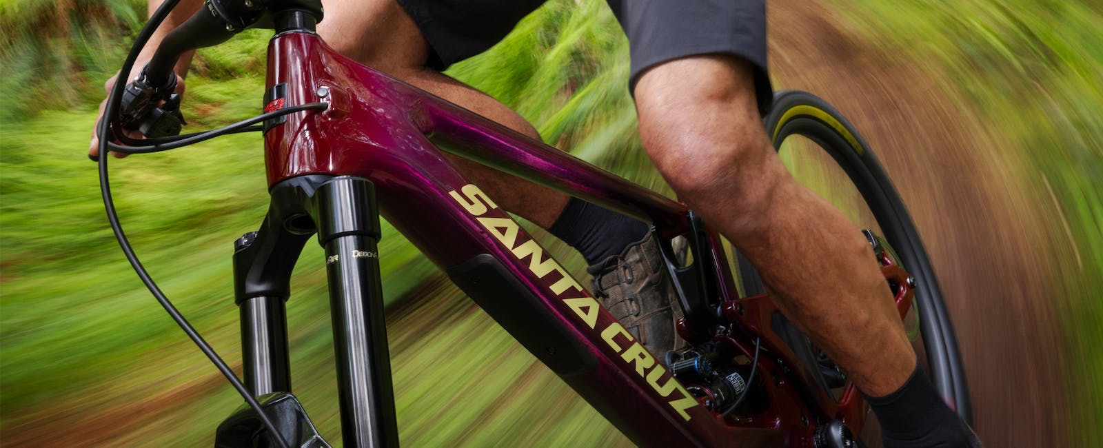 A mountain biker riding the Santa Cruz Hightower 3C 